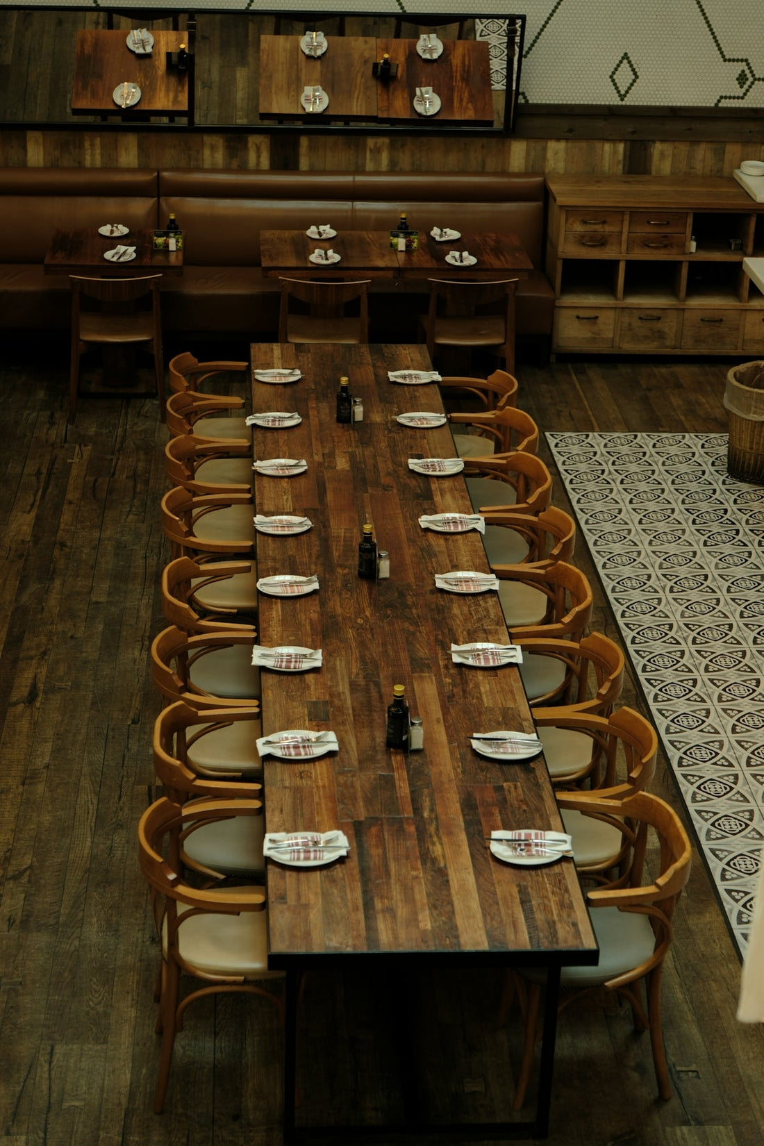 Long wooden table set for a large group meal