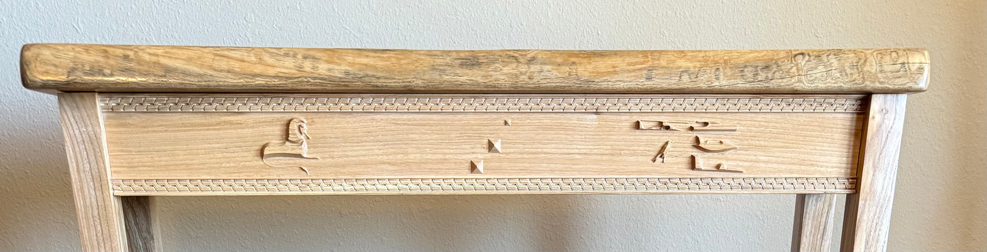 Egyptian symbols carved on apron 