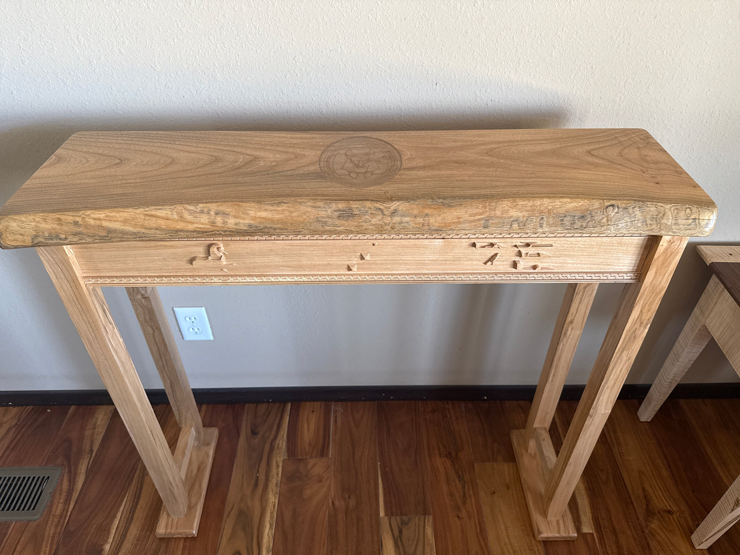 Wooden console table against a plain wall